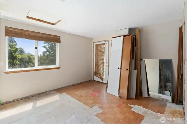 Primary seating area and door to private deck