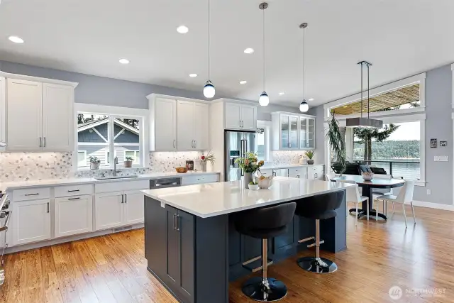 Enjoy sweeping views of Colvos Passage, Vashon Island, & Mt. Rainier from this custom-built NDK home, perfectly positioned to capture the best of the PNW. Designed for comfort and style, the main floor features vaulted ceilings, a wall of windows, open-concept great room & dining,