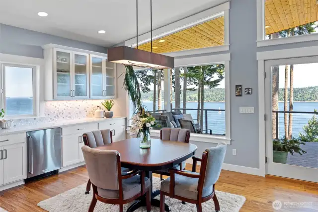 Dining room with beverage fridge and wall of cabinetry & the views