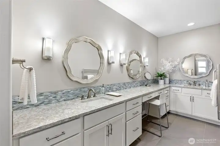 Primary bath with dual sinks, make up area and warming towel rack