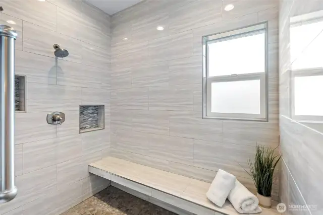 walk in shower with amazing tile work