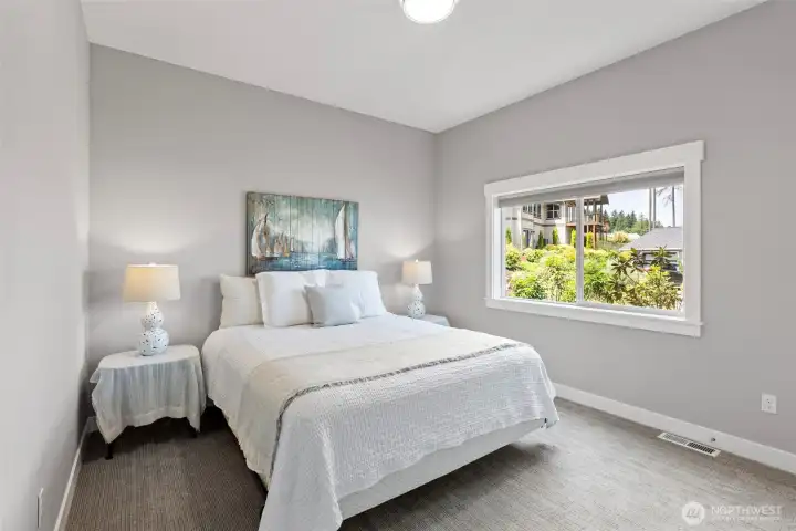 2 bedrooms downstairs with 10 ft ceilings that make the rooms bright and light