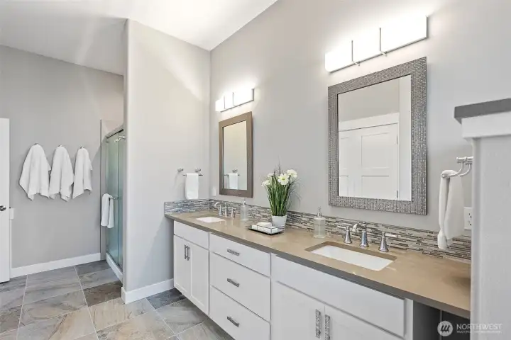 Full bath downstairs with shower, double sinks and bathtub