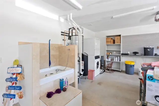 3 car garage with dog washing station.