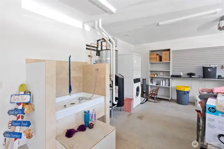 3 car garage with dog washing station.