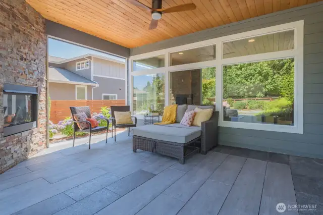 Covered patio with ceiling fan and gas fireplace make this an appealing space for relaxation and entertaining