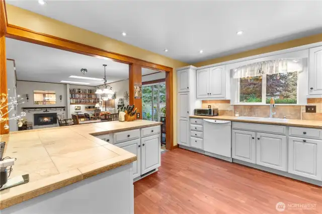 Large island breakfast bar open to dining, family and living room
