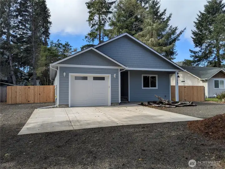 Beautiful, fully fenced custom home with upgraded finishes & EV Charger. Circular driveway and plenty of space for RV parking