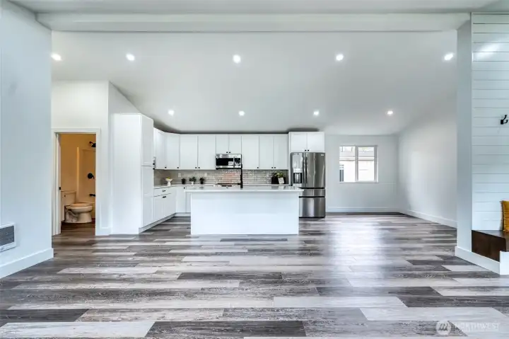 Stunning finishes you're going to love. Bar seating + room for dining table to the right.