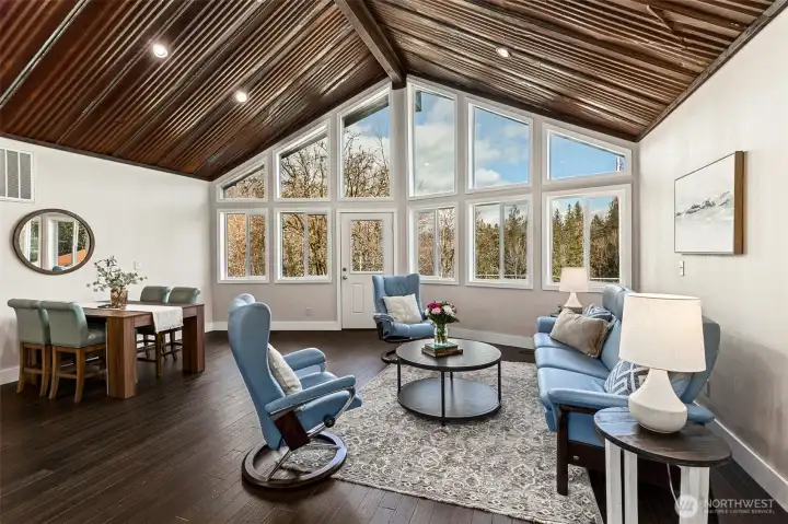 Main House-Living Room with A frame windows overlooking property