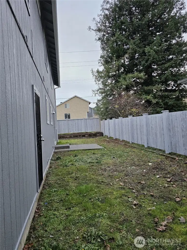 Flat fully fenced backyard