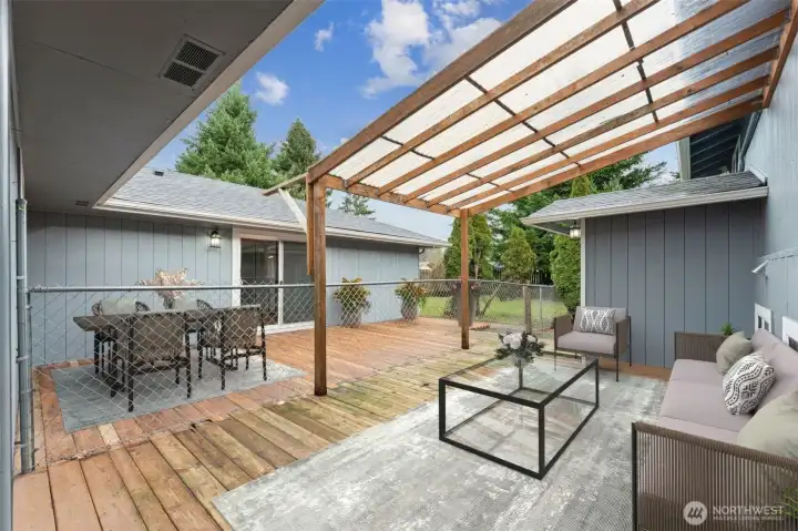 *Virtually staged- In back, large slightly elevated patio area. Fence separates the 1-story portion from the split level. This can easily be removed if so desired.