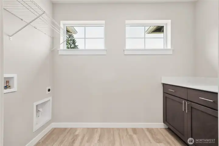 Laundry room has storage galore! Photo's are for representational purposes only. Colors and finishes may differ.