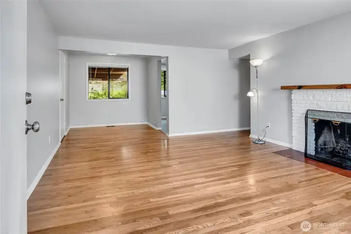 Living and Dining room. The home has hardwood floors throughout most of the home except kitchen and bath.