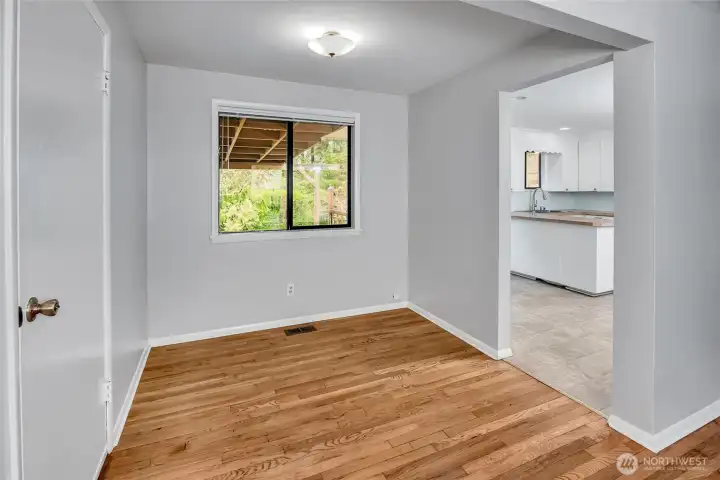 Dining room with views to the backyard. Door on left leads to the garage.