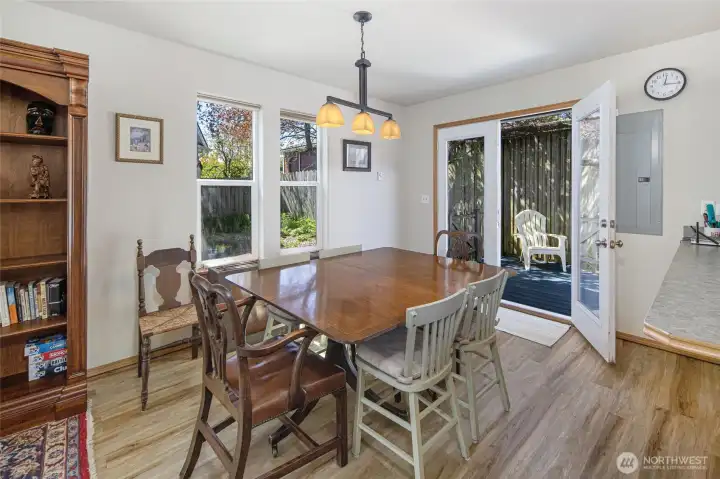 French doors open from dining area to private back deck