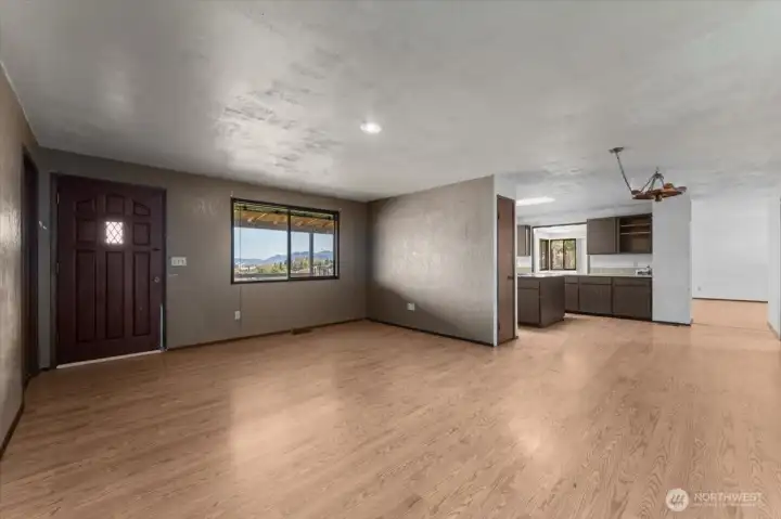 Front door and view towards kitchen.