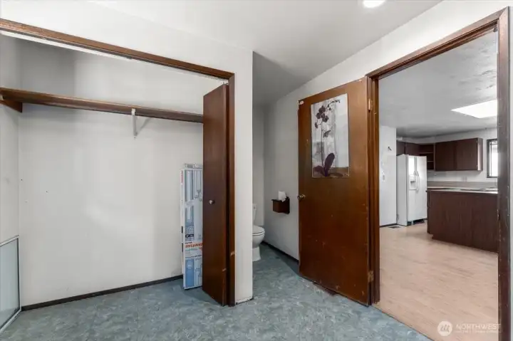 Utility room with 1/2 bath.