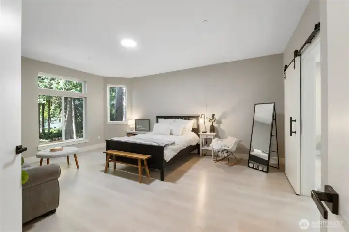 Expansive primary suite with serene peaceful views