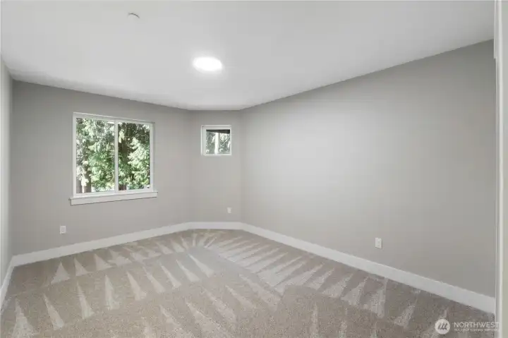 3rd bedroom overlooking private grove and lake