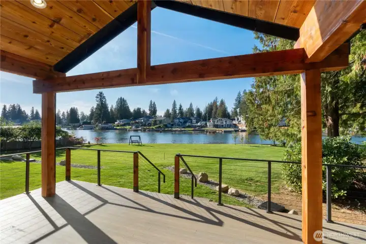 Handcrafted cedar ceiling w/rich and natural warmth creating a cozy atmosphere