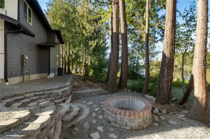2nd outdoor living space with brick firepit!