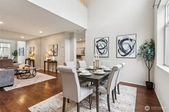 Open dining area with vaulted ceilings creating a bright and airy feel