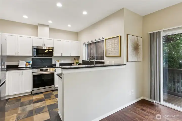Kitchen peninsula with bar seating, perfect for casual dining or entertaining