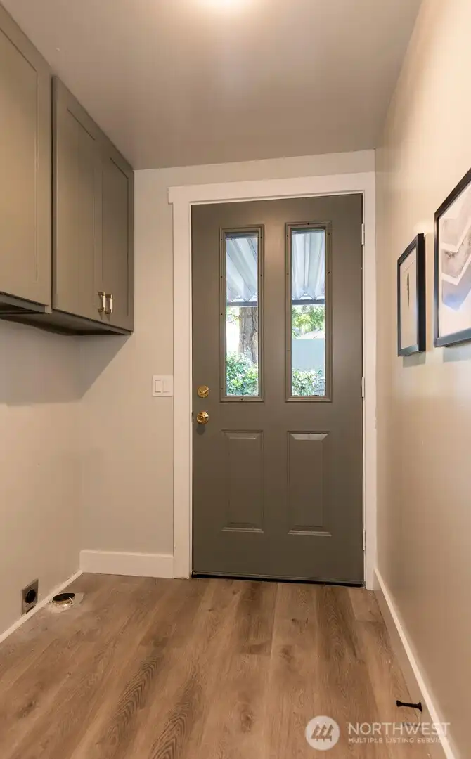 Back entrance and washer and dryer room