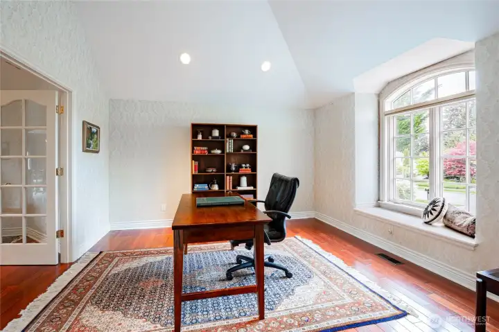 This den/office gets amazing light and flows throw French doors into the large living area!