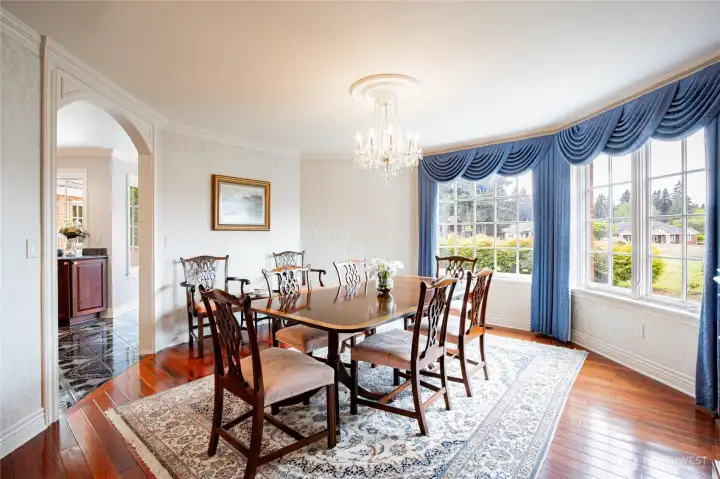 The dining room is right off the living room, the gorgeous cherry wood floors flow throughout.