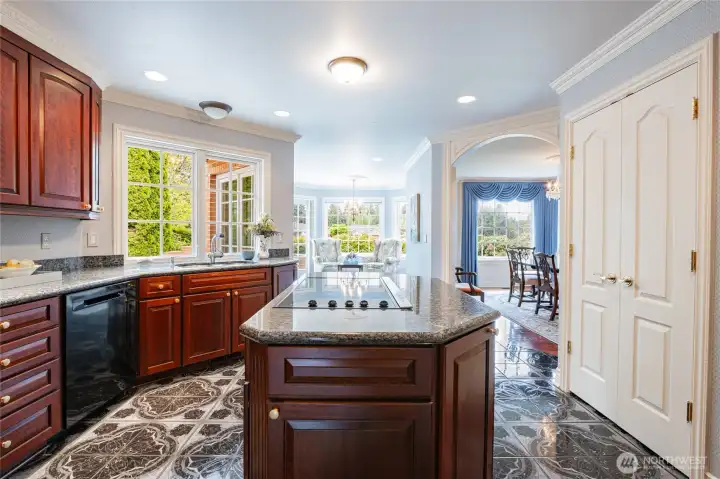 Double door pantry to the right, built in sub-zero refrigerator to the left.