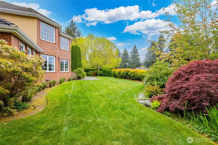 The side of the house leading to the well landscaped backyard.