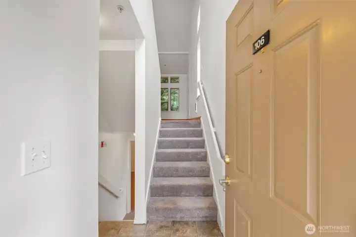 Split entry - upstairs leads to living room / kitchen. Downstairs leads to additional 2 bedrooms.