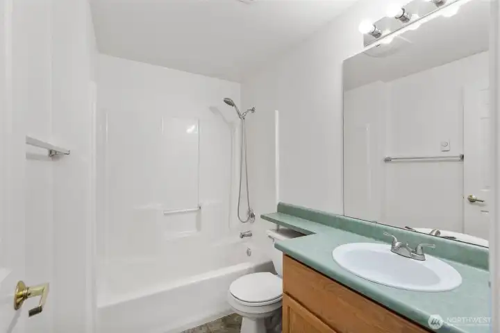 Full bathroom on top level - closest to kitchen and main living area.