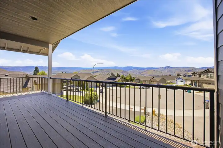 Trex wraparound deck showcasing breathtaking 180-degree valley and hillside views perfect for outdoor entertaining.