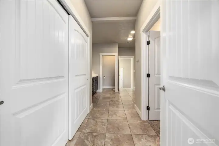 Spa-inspired primary ensuite with double sinks, soaking tub, water closet, and elegant finishes throughout.