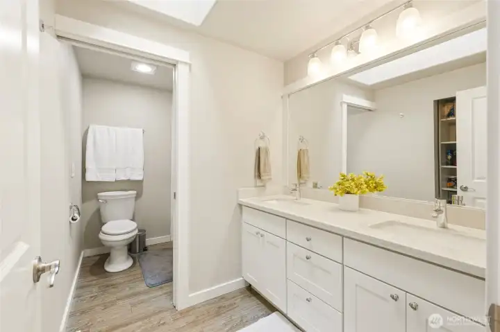 Full bathroom with extended vanity and excellent storage, ideal for shared use between bedrooms.