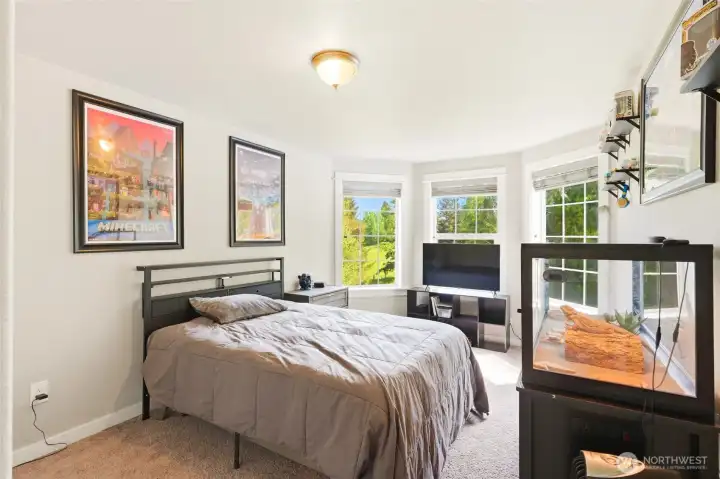 Bright 4th bedroom with large windows and ample space for comfortable living.