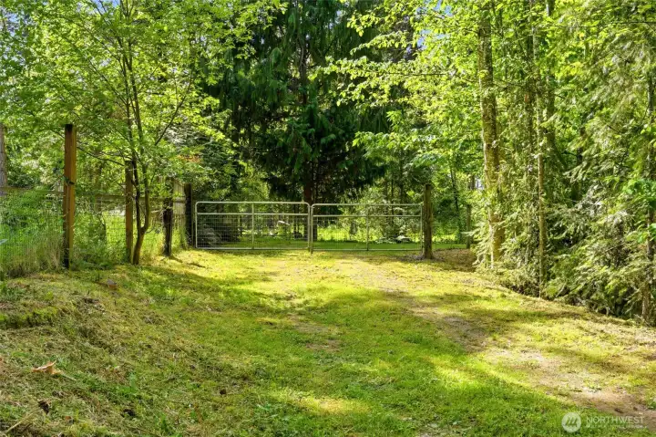 Private gated entry at back of the lot with direct access to the detached shop.