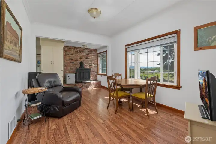 Dining room circles around to kitchen to the left.