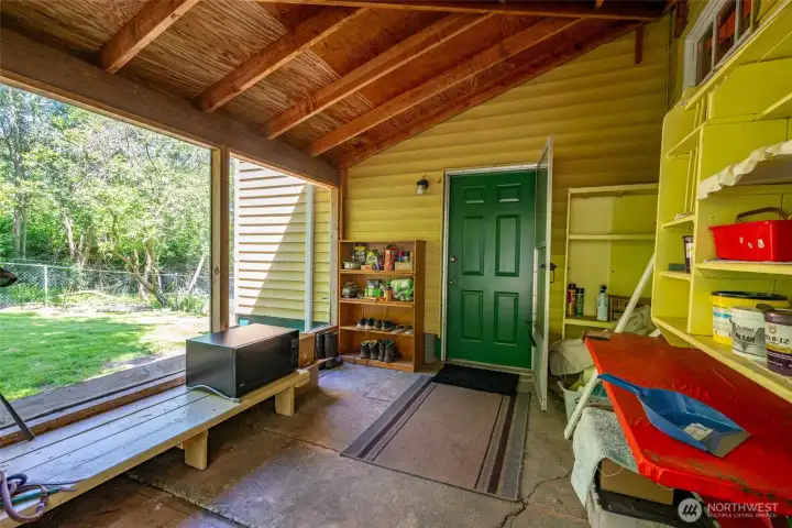 Covered back porch outside of utility room.