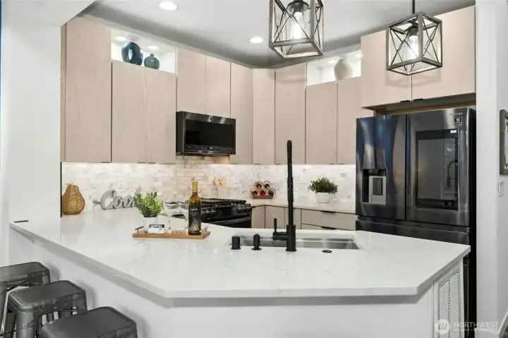 Marble tile backsplash adds to the luxurious finish level. Marble tile backsplash adds to the luxurious finish level.