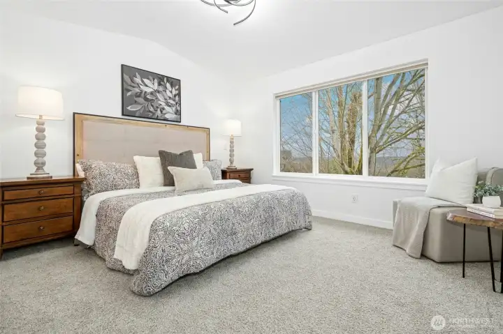 The vaulted primary suite is a showstopper, flooding with natural light and framing those signature PNW views. The vaulted primary suite is a showstopper, flooding with natural light and framing those signature PNW views.