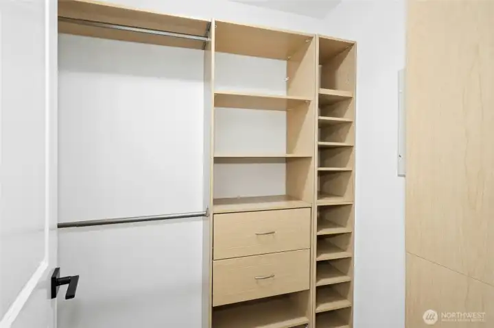 Walk-in primary closet has plenty of room for both! Walk-in primary closet has plenty of room for both!