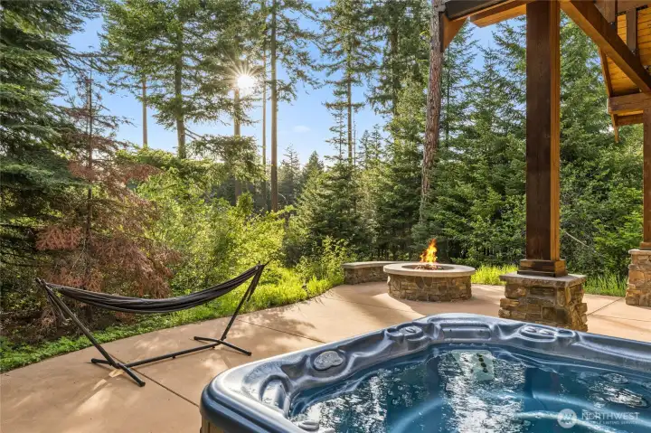 Expanded outdoor patio with hot tub and firepit