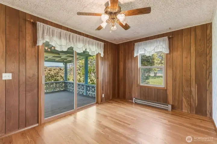 dining room with covered  deck in back