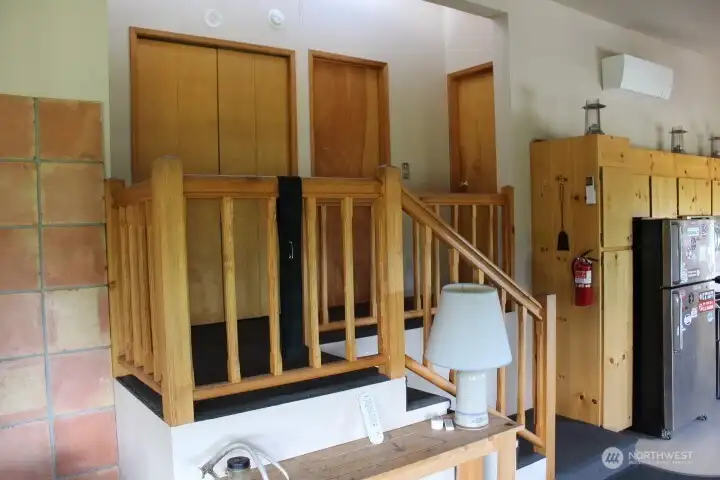 Stairs from kitchen and living room area