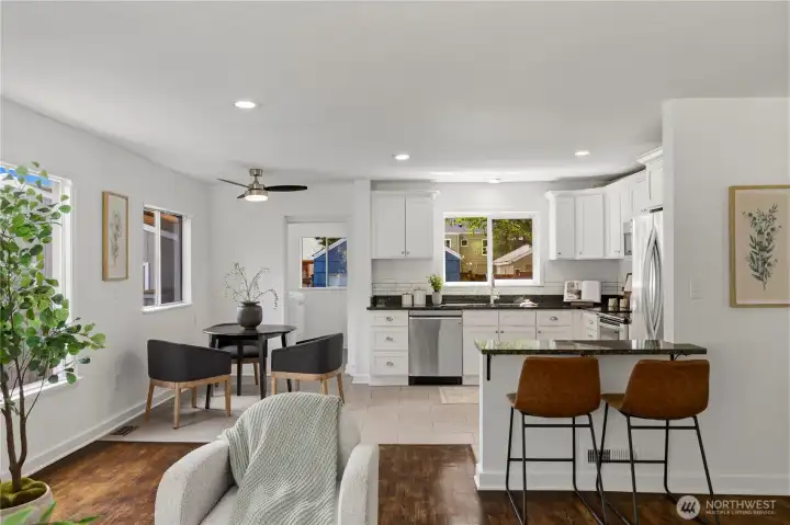 Laundry room past the kitchen, with a door leading to the backyard.