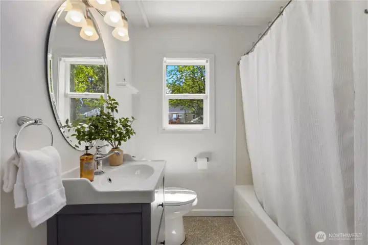 The bathroom on the main level with a tub/shower combo.